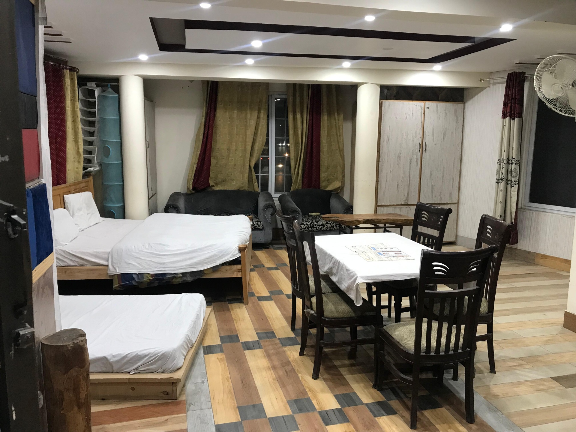 The Deluxe Double Room, with thick bedding and a large window facing the Karakoram mountains